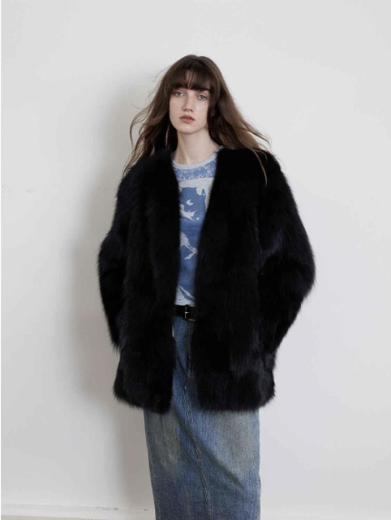 The Black Sugar fox-fur cardigan shown with casual separates. Its full silhouette and open neckline also lend themselves to evening styling.